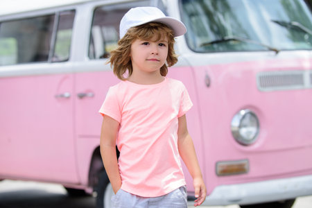 Outdoor closeup portrait of funny kids face. Summer kid outdoor portrait. Close up face of cute child. Kid having fun outdoor on summer day.の写真素材