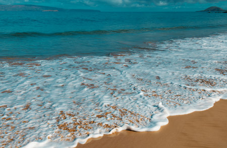 Blue ocean wave on sandy beach. Beach in sunset summer time. Beach landscape. Tropical seascape, calmness, tranquil relaxing sunlight.の写真素材