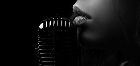 Karaoke. Closeup lip with vintage microphone. Sensual woman singer. Concert singing.の写真素材