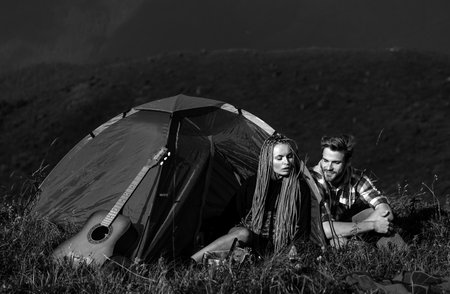 Couple in love on camp outdoors. Love, people, happiness and lifestyle concept.の写真素材
