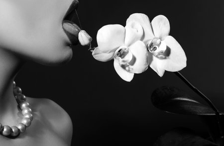 Female lips. Natural beauty lip care. Sensual womens open mouths, Tongue. Close up, macro with beautiful mouths. Sensual lips of a young woman. Cosmetics and beauty salon.の写真素材