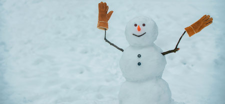 Winter banner. Greeting snowman. Cute snowmen standing in winter Christmas background. Happy winter time. Cute snowman outdoor.の写真素材