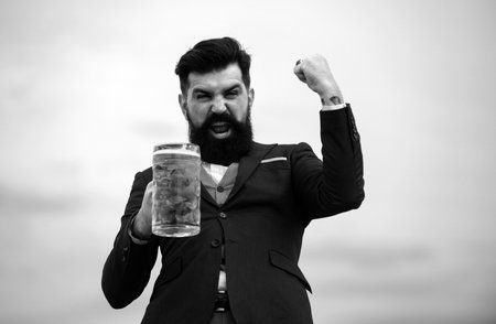 Excited drunk man wwith glass of beer. Expression emotions.の写真素材