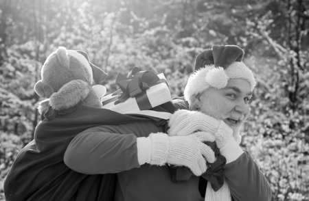 Santa Claus with huge red sack. Merry Christmas and New Year Eve concept.
