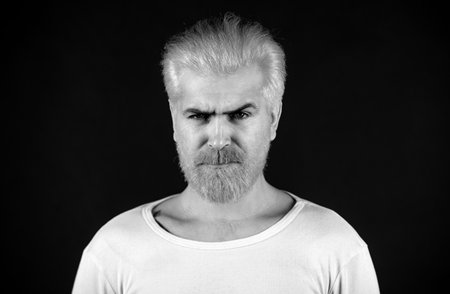 Barbershop, dyed hair and beard. Man beardcare and haircare. Serious bearded man portrait.の写真素材