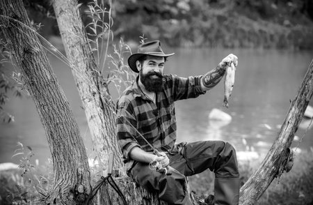 Portrait of cheerful senior man fishing. Summer leisure. Fishing background. Fishing. Make with...