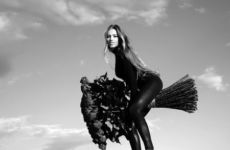 Valentines day flower of love. Woman with roses bouquet outdoor. Lady and roses. Favorite flowers. Beautiful girl on background sky.の写真素材