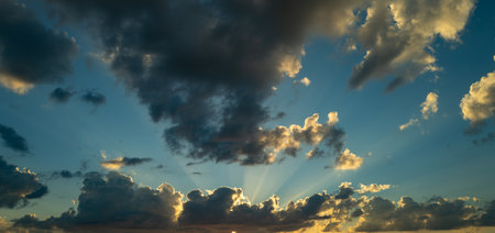 Sunrise Clouds background. Dramatic Clouds Sunset Background. Sky with clouds in Sunrise. Sunrise with clouds in various shapes background. Calm Cloud.の写真素材