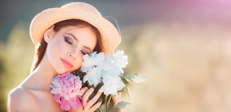 Beautiful Spring Young Woman Outdoors Enjoying Nature. Girl in Green Grass. Spring Meadow. Beautiful...