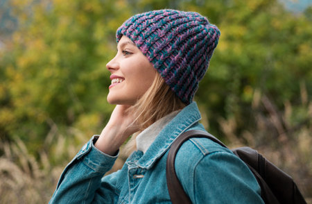 Portrait of a young autumn fall woman, close up face of beautiful woman outdoor. Lifestyle, walk...