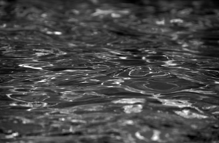 Abstract ripple wave and clear turquoise water surface in swimming pool, blue water wave for background and abstract design.の写真素材