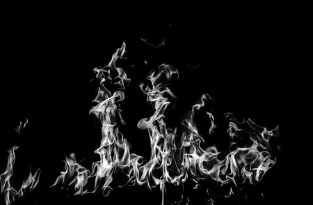 Texture of fire on a black background. Abstract fire flame background, large burning fire.の写真素材