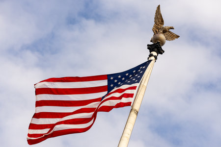 American flag waving in blue sky USA. Flag waving. Independence day. 4th of july. The American flag...
