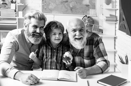 Happy grandfather father and son. Grandpa teaching grangson at home class room. Man generation...
