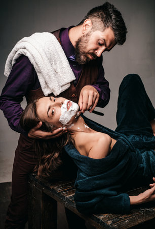Gender equality. Barber concept. Fashion vogue. Woman at barbershop.の写真素材