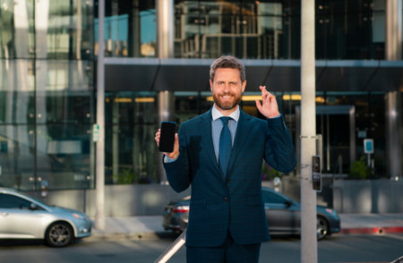 Businessman with phone. Portrait of cheerful Business man office worker talking on mobile phone...