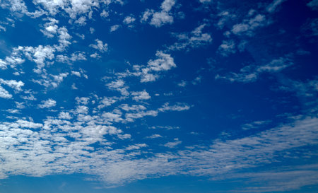 Spring blue sky cloud gradient background. Cloudy sky. Vivid cyan blue landscape in environment day horizon skyline view. White clouds on soft sky background. White cloudy sky.の写真素材