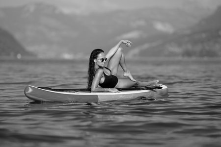 Woman Kayaking of Lake. Summer beauty sexy woman outdoor portrait. Young woman canoeing in the lake...