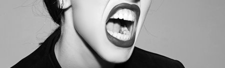 Mouth speech, woman screaming. Pretty girl shouting banner. Open screaming mouth. Horizontal banner for website design. Web banner header, copy space.の写真素材