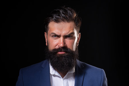 Barber concept. Beard man. Beard care concept. The bristle irritated his skin. Shampoo and conditioner for a bearded man. Male beauty care, facial hair care. Beard oil. Long beard care.の写真素材