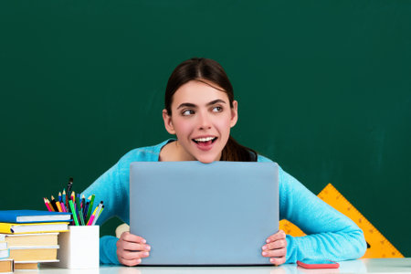 The student girl is studying in the classroom. Student teenager girl learning in the classroom. The...