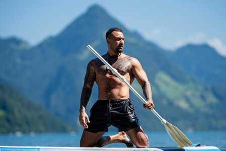 Sexy muscular man standing in summer water. Summer Travel vacation holiday. Relax man, freedom, calm...