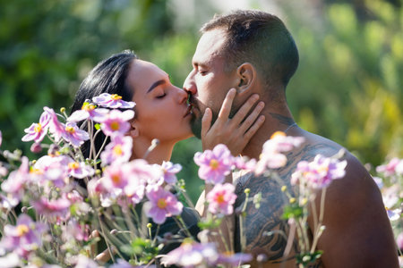 Sexy kiss. Spring love. Couple in love kissing. Passionate kiss. Romantic moment. Tender lovers. Couple embrace and kissing. True love. Loving embrace. Dreamy kiss. Romantic gesture. Love in a kiss.の写真素材