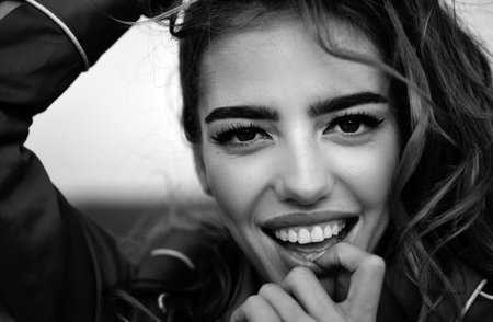 Closeup spring smiling girl outdoor. Happy woman, smile, positive emotions. Beauty and care.の写真素材