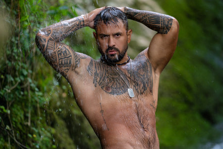 Sexy man on nature. Muscular handsome guy. Muscular body. Strong athletic man. Fit male model. Healthy handsome Athletic Man. Muscular male model outdoor. Guy showing muscular fit body. Sexy torso.の写真素材