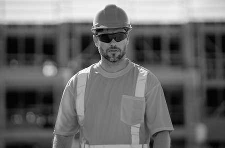 Hispanic 40s worker builder man on site construction. American middle aged man worker. Millennial...