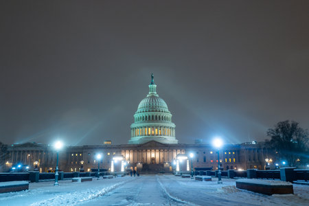 Washington D. C. in winter snow. Capitol Building in night. Washington city Capitol. United States Capital. USA landmark. Washington D.C. Night Washington Capital city.の写真素材