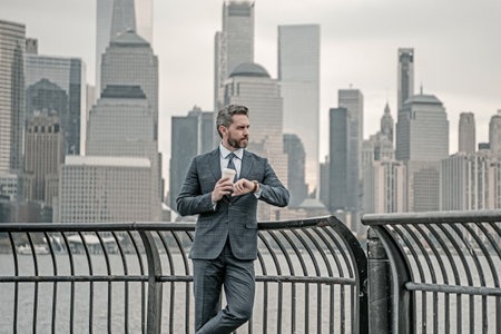Boss. Handsome mature businessman walk outside. Businessman walking on the street in New York. Gray businessman with beard in business suit in city street in NYC. Manager near Manhattan street.の写真素材