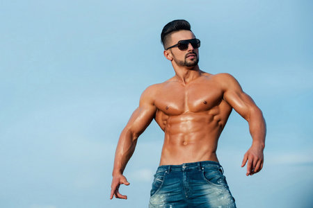 Attractive topless guy. Young sexy man with muscular body. Sexy male model. Seductive guy. Handsome...