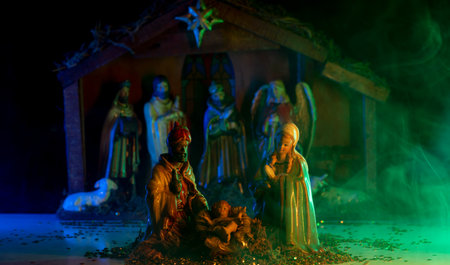 Bethlehem. Traditional Christmas scene birth of Jesus. Christmas creche with Joseph Mary and Jesus. Christmas Manger scene with figurines including Jesus, Mary, Joseph, sheep and magi.の写真素材