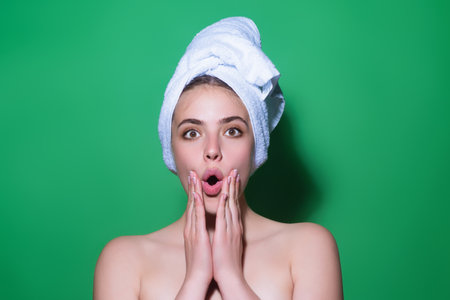 Facial treatment. Young woman with clean fresh skin. Beauty portrait of young women with beautiful face, young elegant girl. Portrait of female model in studio. Cosmetology and makeup.の写真素材