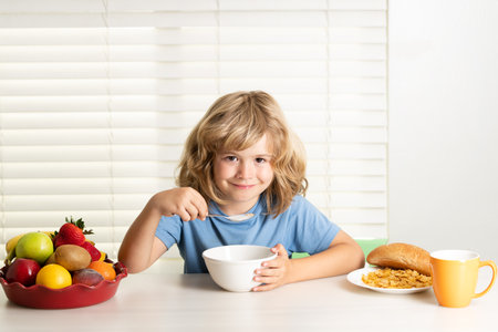 Child boy eating organic healthy food. Healthy vegetables with vitamins. Proper kids nutrition concept.の写真素材