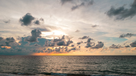 Sunset sea landscape. Colorful beach sunrise with calm waves. Nature sea sky. Sunrise with clouds of...