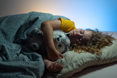 Kids pillow and blanket for sleeping. Little boy sleeps. Adorable kid sleeps in bed. Sleeping child....