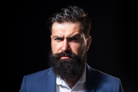 Portrait of the handsome man. A Hipster guy model headshot. Male face. Bearded handsome man. Confident male model. Man looking proud. Closeup face of attractive man. Beard and moustache.の写真素材