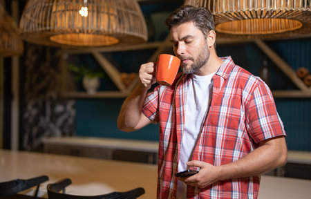 Good morning. Man awake in morning drink coffe. Portrait of man with cup or mug. Morning hygiene. Morning routine for guy. Happy wake up.の写真素材