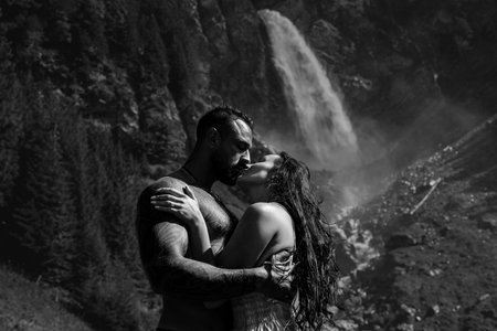 Summer vacation in nature. Couple in love outside. Sexy couple hugged in nature. Sensual couple in love outdoors. Carefree couple cuddled in nature. Sensual embrace on green nature.の写真素材