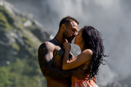 Love, carry and couple at nature. Couple on vacation, adventure and holiday for valentines day. Sexy man with embrace for bonding, together and woman on romantic trip on waterfall.の写真素材