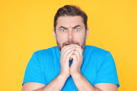 Portrait of shocked amazed excited scared man. Handsome middle age senior man worried, nervous, scared. Afraid scared man. Handsome man scared. Human emotions, facial expression concept.の写真素材