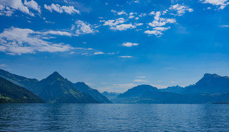 Mountain in the Switzerland in summer, panoramic view with mountain. Switzerland Alps nature and travel. Alpine scenery. Mountain with lake in Switzerland. Summer view over the lake and the alps in Switzerland.の写真素材