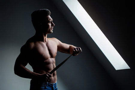 Handsome young sexy man with perfect muscular naked body. Shirtless sexy muscled male model. Muscular handsome guy with strong body. Sexy sport muscle guy. Sexy man with naked torso, muscles guy.の写真素材