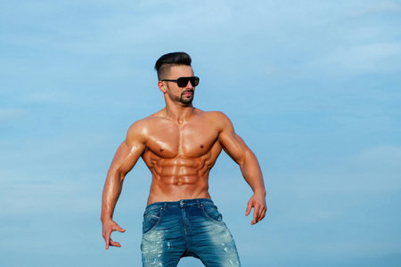 Sexy male model with muscular nude body. Shirtless sexy male model. Muscular handsome model with...