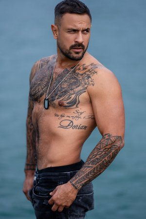 Handsome man with topless body. Muscular torso. Strong brutal guy. Portrait of handsome sexy man. Muscular model. Handsome young man with naked body, bare torso, undressed. Sexy man.の写真素材