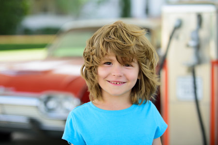 Portrait of kid outdoors. Close-up face child playing outdoors in summer park.