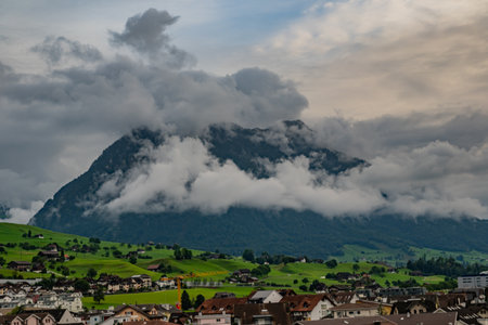 Mountain in the Alps in summer, panoramic view with mountain. Switzerland Alps nature and travel. Alpine scenery. Mountain with lake in Alps. Summer view over the lake and the alps in Switzerland.の写真素材