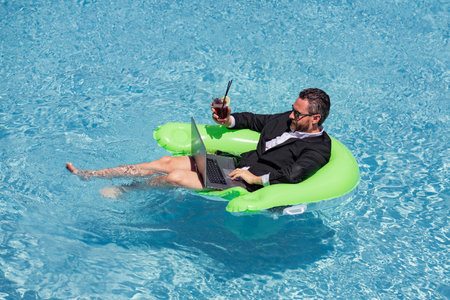 Summer weekend and remote freelance work. Crazy comic business. Funny businessman in suit with...